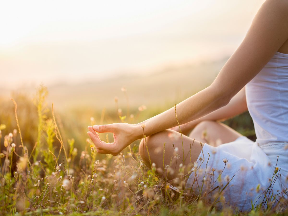 A person meditating, representing mental health and emotional wellbeing