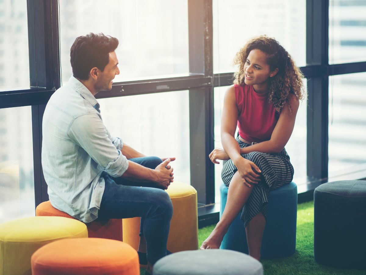 Two people talking together, representing connection and healthy relationships